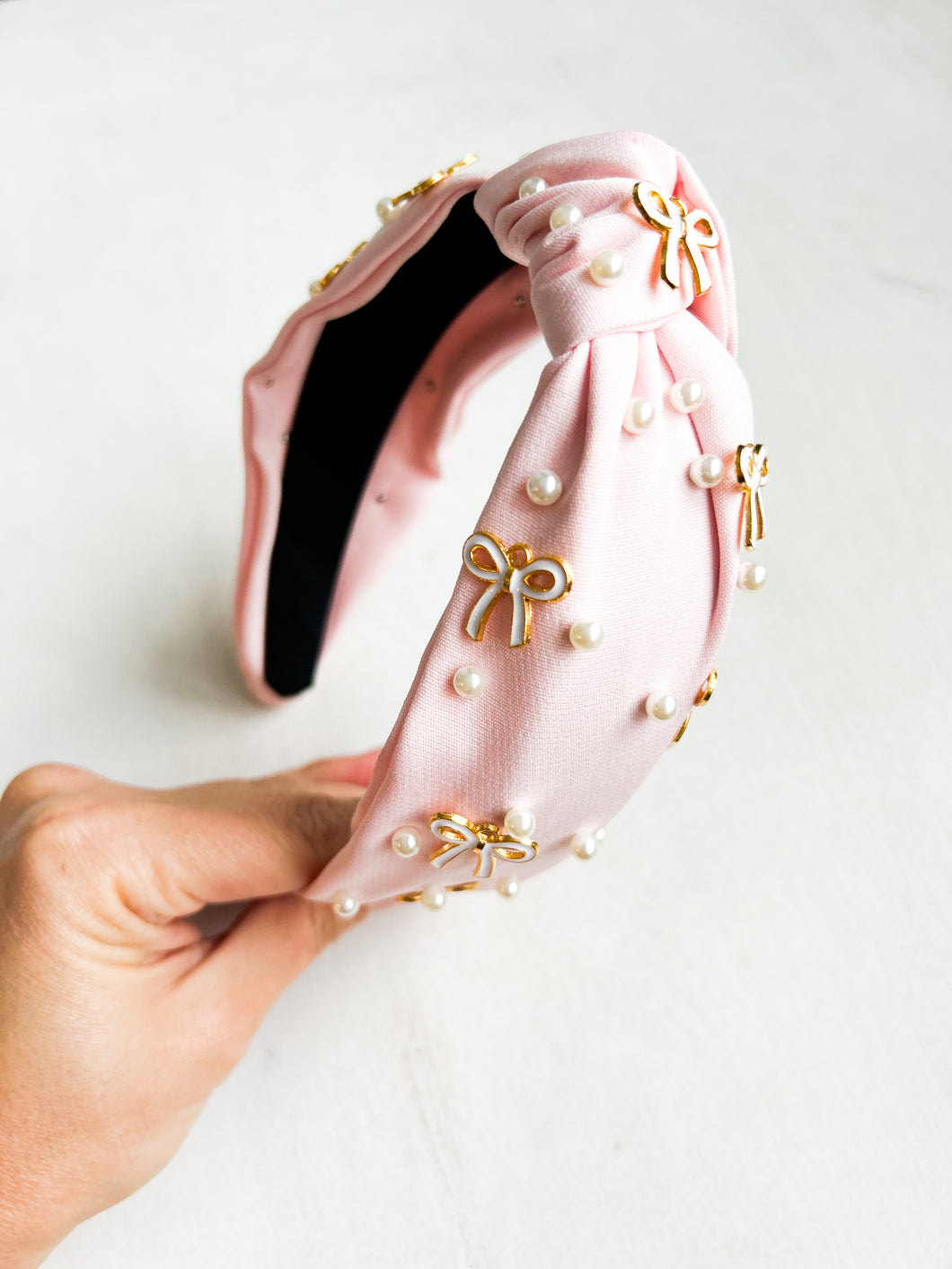 Girlie pop bow headband on soft pink