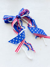 Load image into Gallery viewer, Stars + Stripes Longtail Yarn Bow
